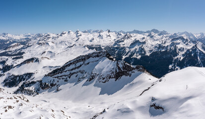 Swiss Alps. Peaks of mountains in snowdrifts. View from the top of Mount Stoss. Canton of Schwyz.