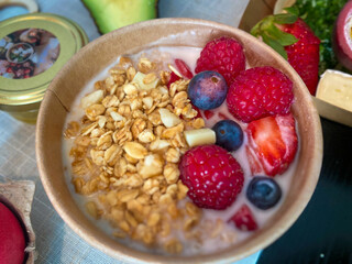 breakfast muesli bowl with fruits and yoghurt