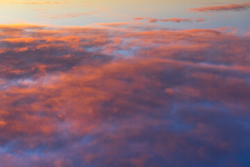 infinite colorful cloudscape at sunset background