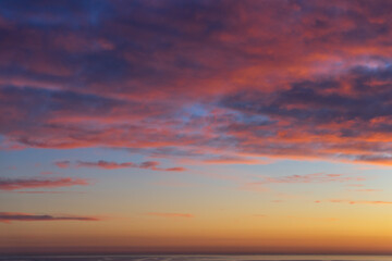 Naklejka na ściany i meble beautiful sky and warm mediterranean light at sunset