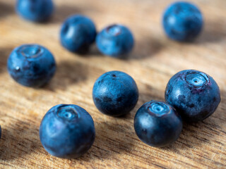 Close-up of ripe delicious blueberries on a wooden background. Healthy natural products, vitamins. selective focus