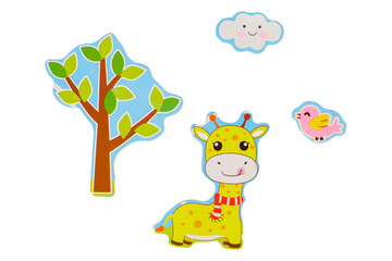 Cardboard figures on a white background, isolated cows, trees, birds and clouds