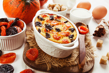 Pumpkin casserole with dried fruits - 425335319