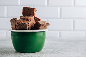 Raw vegan chocolate fudge. Healthy vegan food concept.