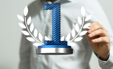 winner first place award in hand