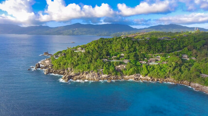 Fototapeta premium Drone viewpoint of beautiful Anse La Liberte', Seychelles coastline on a sunny day