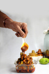 Very Popular homemade mango pickle or kache  aam ka aachar msde in India during summer season.