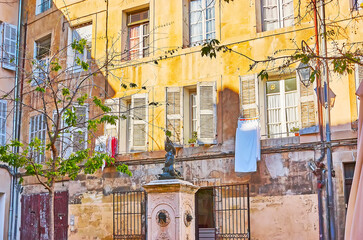 The tiny Place des Fontetes Square with historic Fontetes fountain, Aix-en-Provence, France