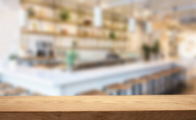 Obraz na płótnie Canvas Wooden table top with blur in cafe or (cafe, bar, restaurant) background. For product display installation or key visualization