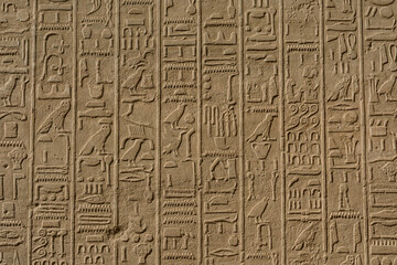 Egyptian ancient hieroglyphs on the stone wall