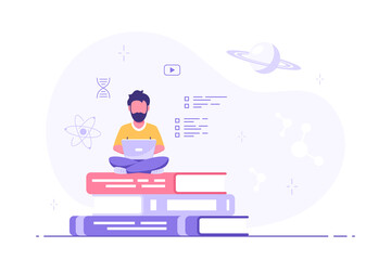 Man with laptop sitting on book stack
