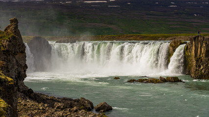 view of the majestic Godafoss waterfall near the city of Akureyri during summer season 