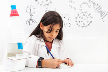 Naklejka premium Young girl playing a life sciences professional role. Could be biologist, doctor, researcher. Dreaming about the future.