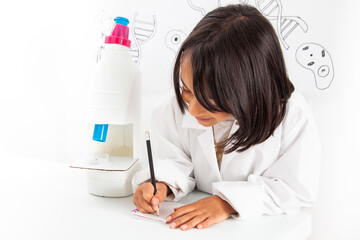 Young girl playing a life sciences professional role. Could be biologist, doctor, researcher. Dreaming about the future.