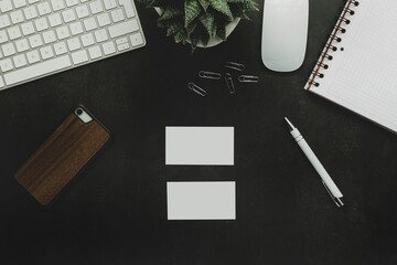 Flat lay top view office desk with blank business card