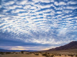 Dramatic sunrise clouds and sand dunes at Death Valley National Park