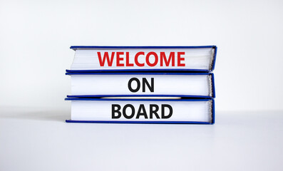 Welcome on board symbol. Books with words 'Welcome on board'. Beautiful white background. Business, welcome on board concept, copy space.