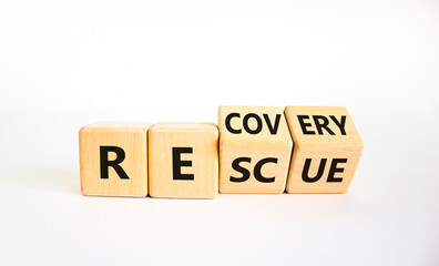 Recovery and rescue symbol. Turned cubes and changed the word 'recovery' to 'rescue'. Beautiful white background. Business and recovery - rescue concept. Copy space.