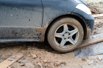 stuck car on a bad muddy road