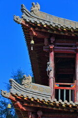 Red wooden balcony-southwest roof corner-Buddhist Sutras Hall-DafoSi-Great Buddha Temple. Zhangye-Gansu-China-1272