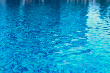 Abstract pool water.  Swimming pool flow with waves background surface of blue swimming pool