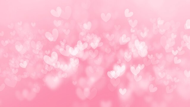 Pink wallpaper background with beautiful heart shape bokeh.