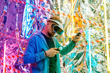 a young man in a VR helmet, VR glasses augmented virtual reality in the style of cyberpunk. 3d vision technology
