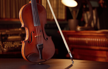 Violin in retro style and bow, closeup view
