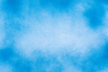 Obraz premium Abstract spray paint blue and white color on center on paper texture background