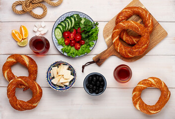 Traditional Turkish bagel simit, breakfast, on a wooden table, rustic, horizontal, no people,