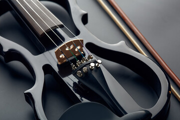 Modern electric violin and bow, closeup view