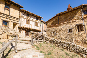 Fototapeta na wymiar a street with traditional old houses in Calatanazor, province of Soria, Castile and Leon, Spain