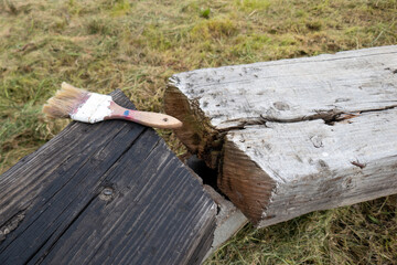 Comparison between two wooden benches. One old and ruined, the other treated and impregnated with...