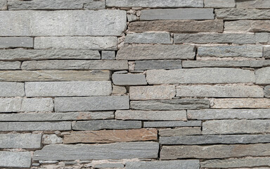 grey stone wall closeup, textured pattern natural background
