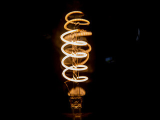 decorating vintage incandescent light bulb in the dark