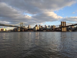 Obraz na płótnie Canvas Evening sun over the Brooklyn & Manhattan Bridges, New York - March 2021