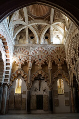 Interior of Mezquita–Cathedral of Cordoba with dome and arches