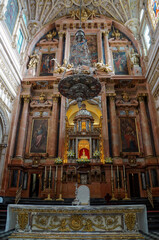 Fototapeta premium Interior with catholic altar and icons in Cathedral of our Lady of the Assumption in Cordoba, Spain