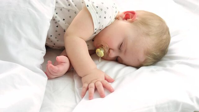 baby sleeps in a crib. selective focus.