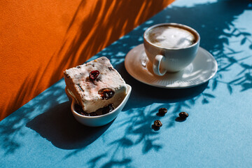 Breakfast with a Cup of coffee with cream and cakes