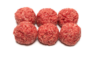 Raw meat balls isolated on white background.