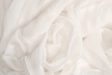 Soft smooth white silk fabric background. Fabric texture.