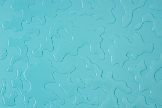 Liquid Water Spill On Blue Background Covering Whole Frame, Spilled Water Flat Lay, Top View