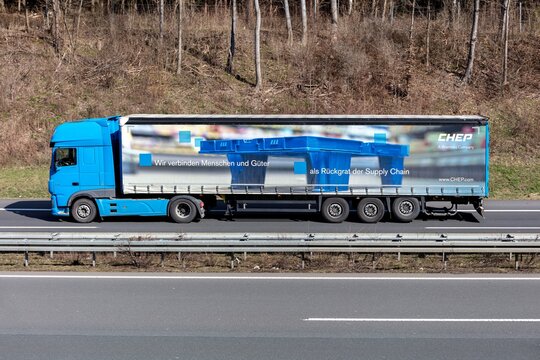 WIEHL, GERMANY - MARCH 24, 2021: Chep DAF XF truck with curtainside trailer on motorway.
