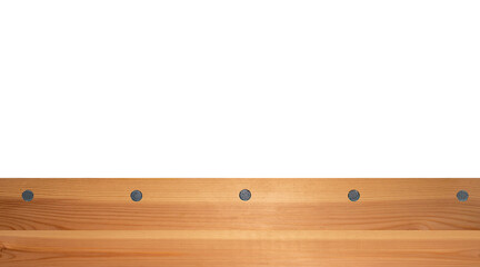 Top view light wood texture surface with natural pattern and metal nail heads or hats. Wooden pine board isolated on white. Spruce table with knots. Rustic craft. Workbench. Box edge.