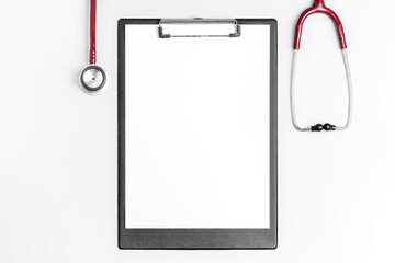 Flat lay photo of medical clipboard with stethoscope..