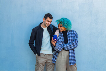 couple with mobile phone on the wall