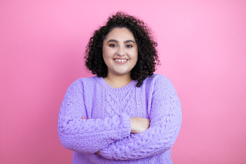 Young beautiful woman wearing casual sweater over isolated pink background with a happy face standing and smiling with a confident smile showing teeth with arms crossed