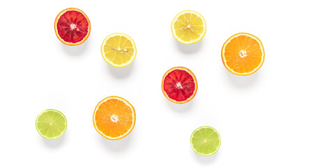 Halves of citrus fruits isolated on white background. Fresh orange, lime, red orange and lemon. Banner. Top view.