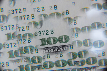 US 100 dollar banknote through kaleidoscope prism
